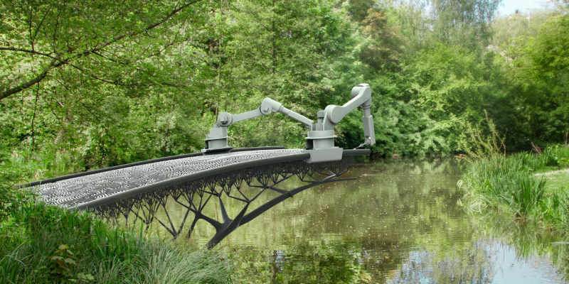 Two robots building a 3D printed bridge over a stream.