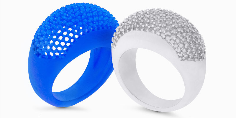 3D Printed ring mold next to the final precious metal ring