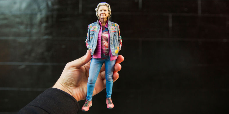 A hand holding a 3D printed figurine